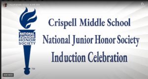 A white background with a blue torch and the letters Crispell Middle  School National Junior Honor Society Induction Celebration