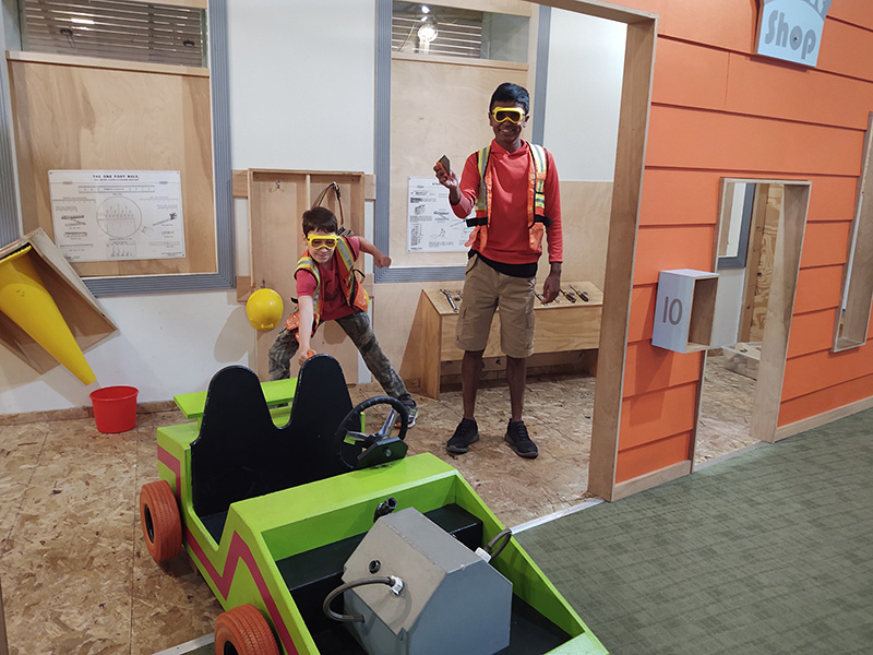 Two middle school boys dress as construction workers.