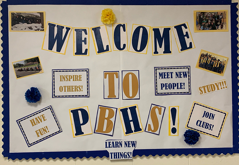 A white background with blue and gold letters that say Welcome to PBHS.